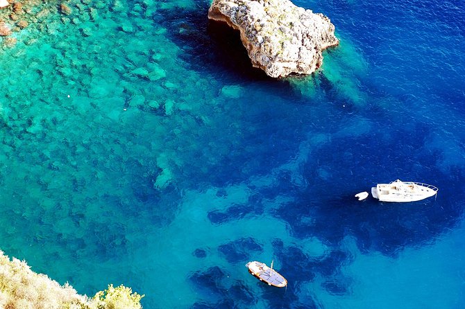 Capri by Sea Private Boat Excursion - The southwestern tip and its pink and white lighthouse