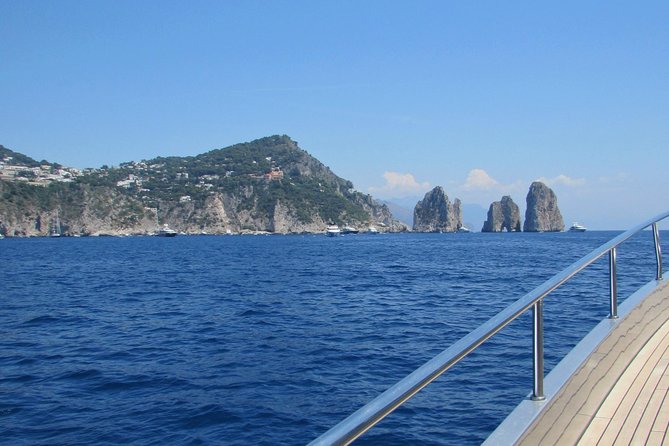 Capri by Sea Private Boat Excursion - Passing through the Faraglioni rocks