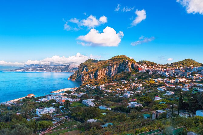 Capri Guided Boat Experience with Island Exploration and Transfer - Faraglioni Rocks and the best photo stop