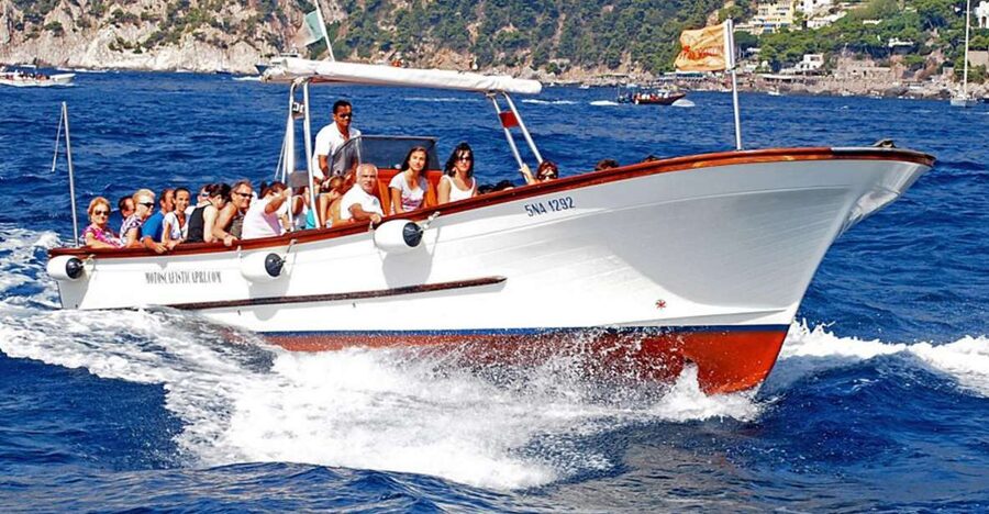 Capri: Island Boat Tour with Blue Grotto Stop - Passing through the Faraglioni Rocks