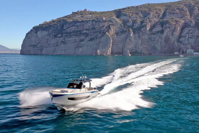 Capri Private all inclusive Boat Tour with City Exploration - Cala del Rio, Cala del Tombosiello, and Punta Carena
