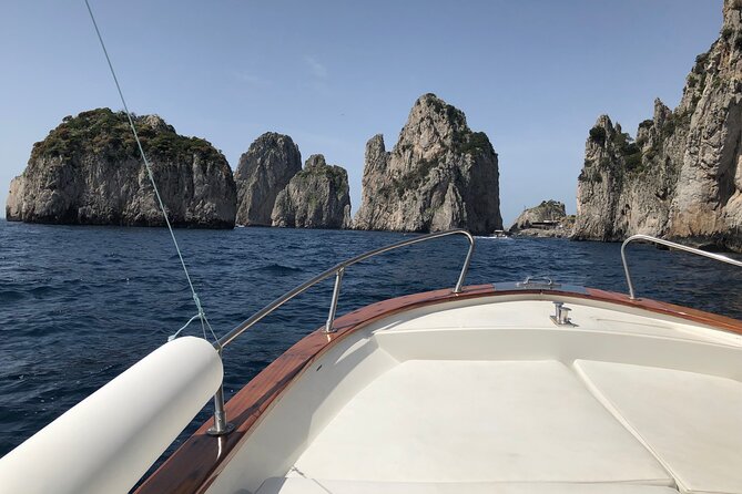 Capri Private Boat Tour from Capri (3 Hours) with Blue Grotto - Grottos, swimming, and a boat ladder
