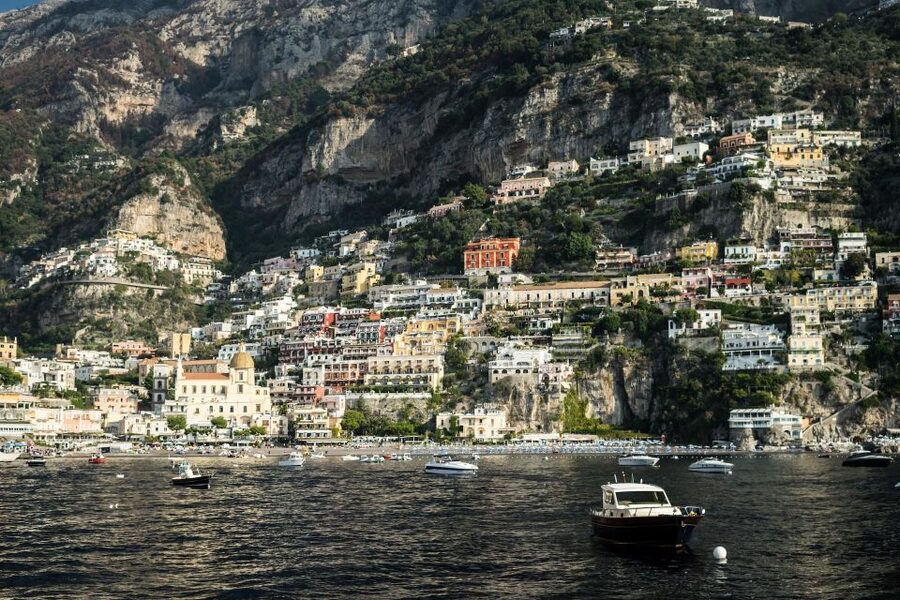 From Amalfi: 7H Amalfi Coast - Group Tour by boat - Cruising toward Positano past Amalfi’s cliffs