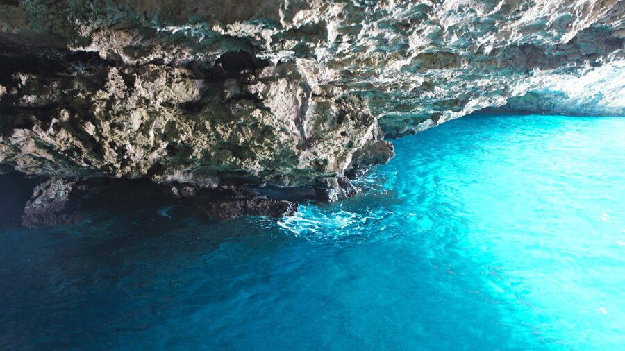 From Positano: Capri Island Group Cruise with Blue Grotto - The caves and rock formations around Capri