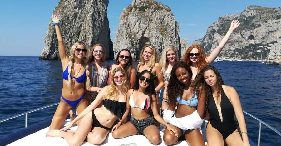From Sorrento: Capri Boat Trip with City Visit & Swim Stops - Faraglioni rock formations from the sea
