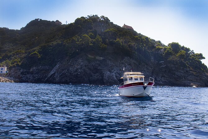 Group Capri tour , visit of caves, fishing legend and swimming - The Faraglioni and the classic Capri photograph