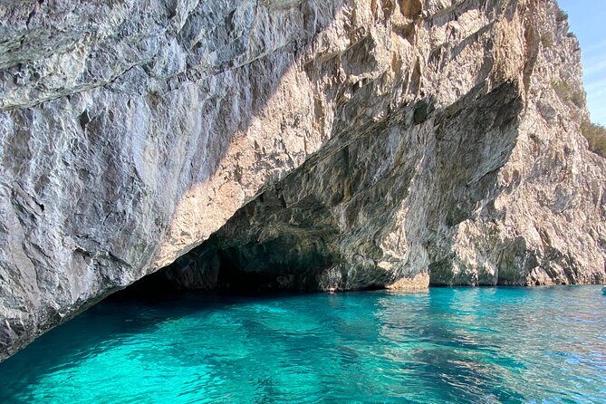 Half day tour of Capri by private boat - Passing beneath the Faraglioni