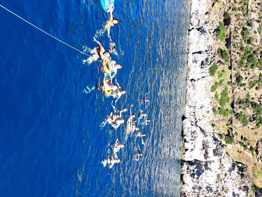 Ischia: Island Boat Tour with Neapolitan Lunch & Snorkeling - Sant’Angelo brings the first swim and a glass of wine