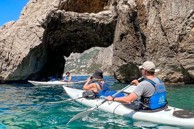 Kayak tour in Capri between caves and beaches. Photos included. - The Faraglioni photo stop