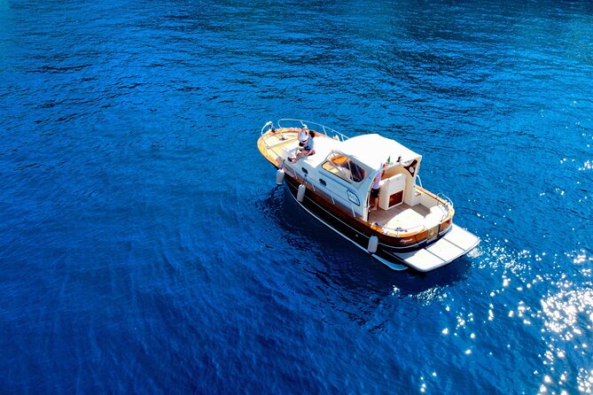 Luxury private boat tour to Capri and Blue Grotto on Gozzo 32 ft - Capri’s caves, coves, and swimming stops