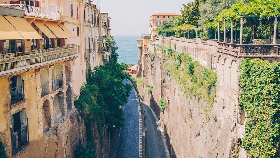 Naples: Full-Day Sorrento, Positano, and Amalfi Tour - Positano brings stairs, flowers, and the coast below