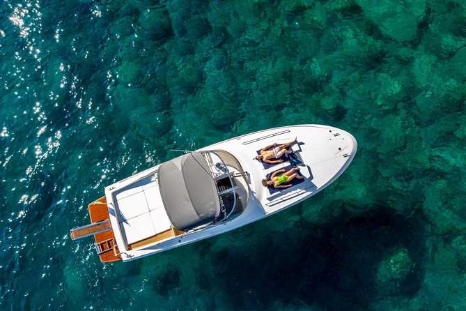One Day Private Boat Tour of Capri - Swimming and snorkeling in clear water