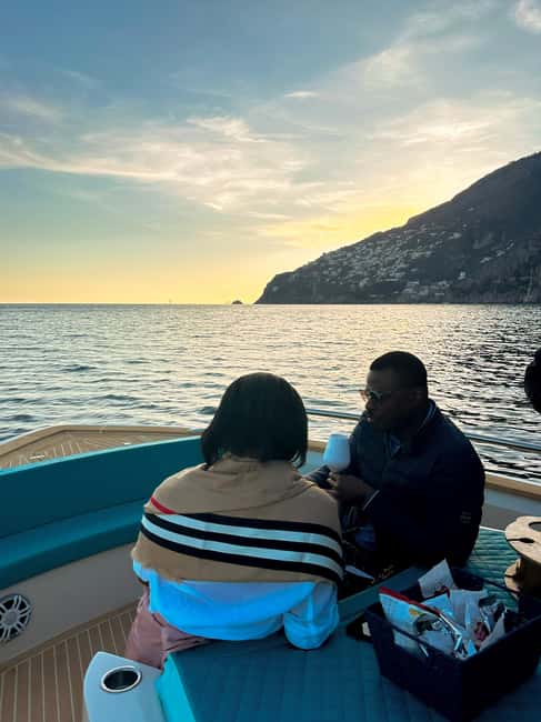 Positano: Shared Sunset Cruise - Returning to Positano as the lights come on