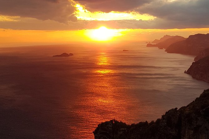 Private boat tour among the wonders of Capri and Positano - White Grotto and the statue in the rock