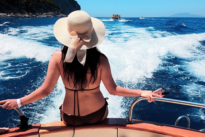 Private Tour to Capri & Positano from Sorrento Classic Gozzo 850 - Passing beneath the Faraglioni
