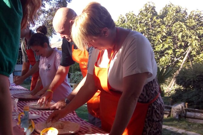 Sorrento Pizza Class with Wine, Limoncello and Transfer Included - Baking your pizza in the wood oven