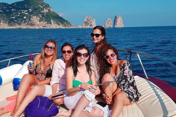 Sorrento to Capri Private Boat Experience on a Gozzo Apreamare 10 - Passing beneath the Faraglioni